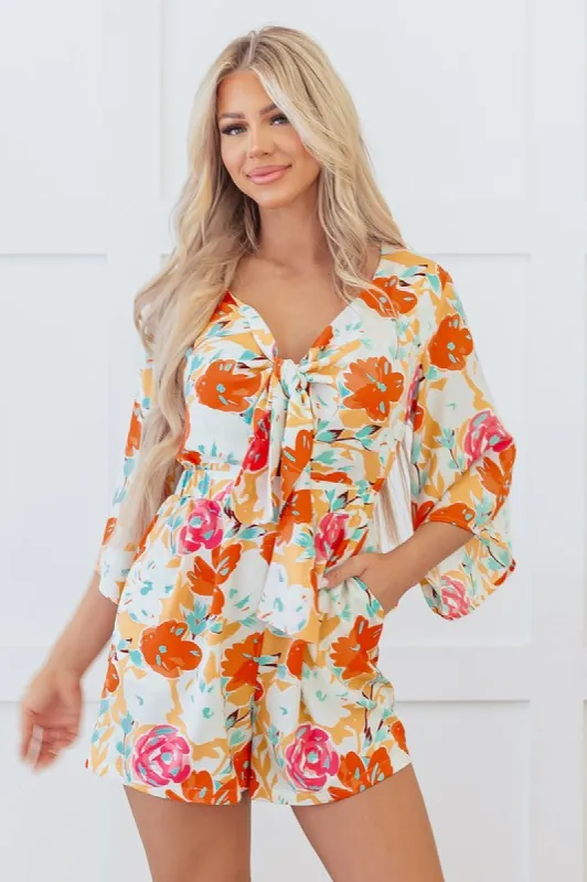 Orange Blooming Floral Print Front Tie Romper sold by Charming Charlie