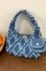Raw Edge Denim Handbag with Pouch sold by Charming Charlie