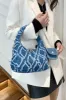 Raw Edge Denim Handbag with Pouch sold by Charming Charlie