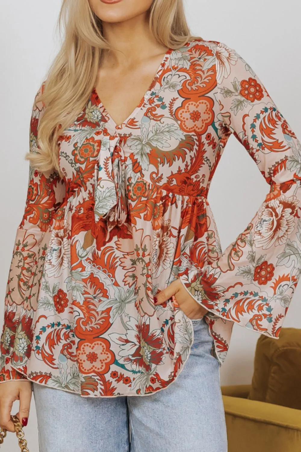 Floral V-Neck Flare Sleeve Blouse sold by Charming Charlie