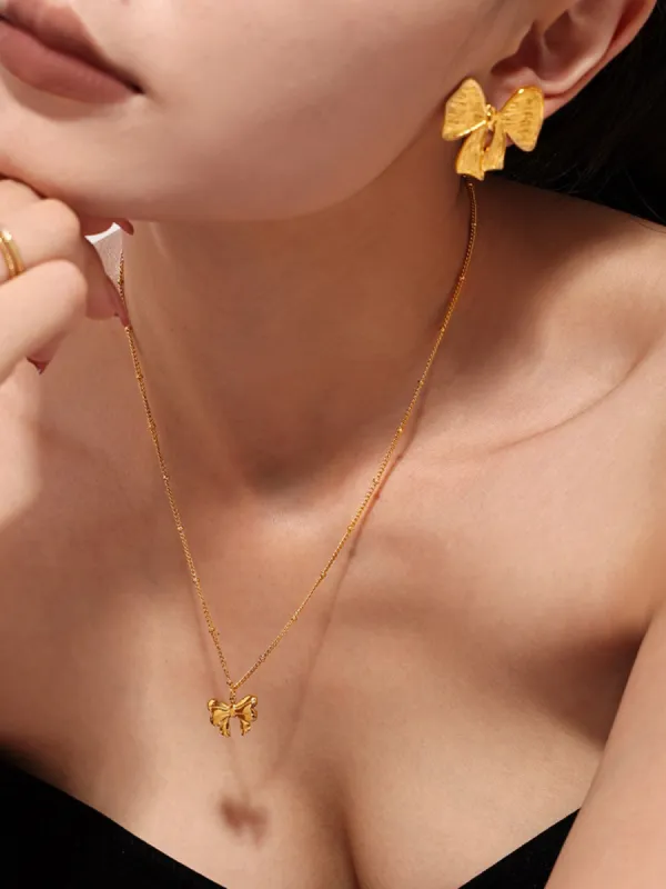 18K Gold-Plated Stainless Steel Bow Earrings and Necklace Set sold by Charming Charlie