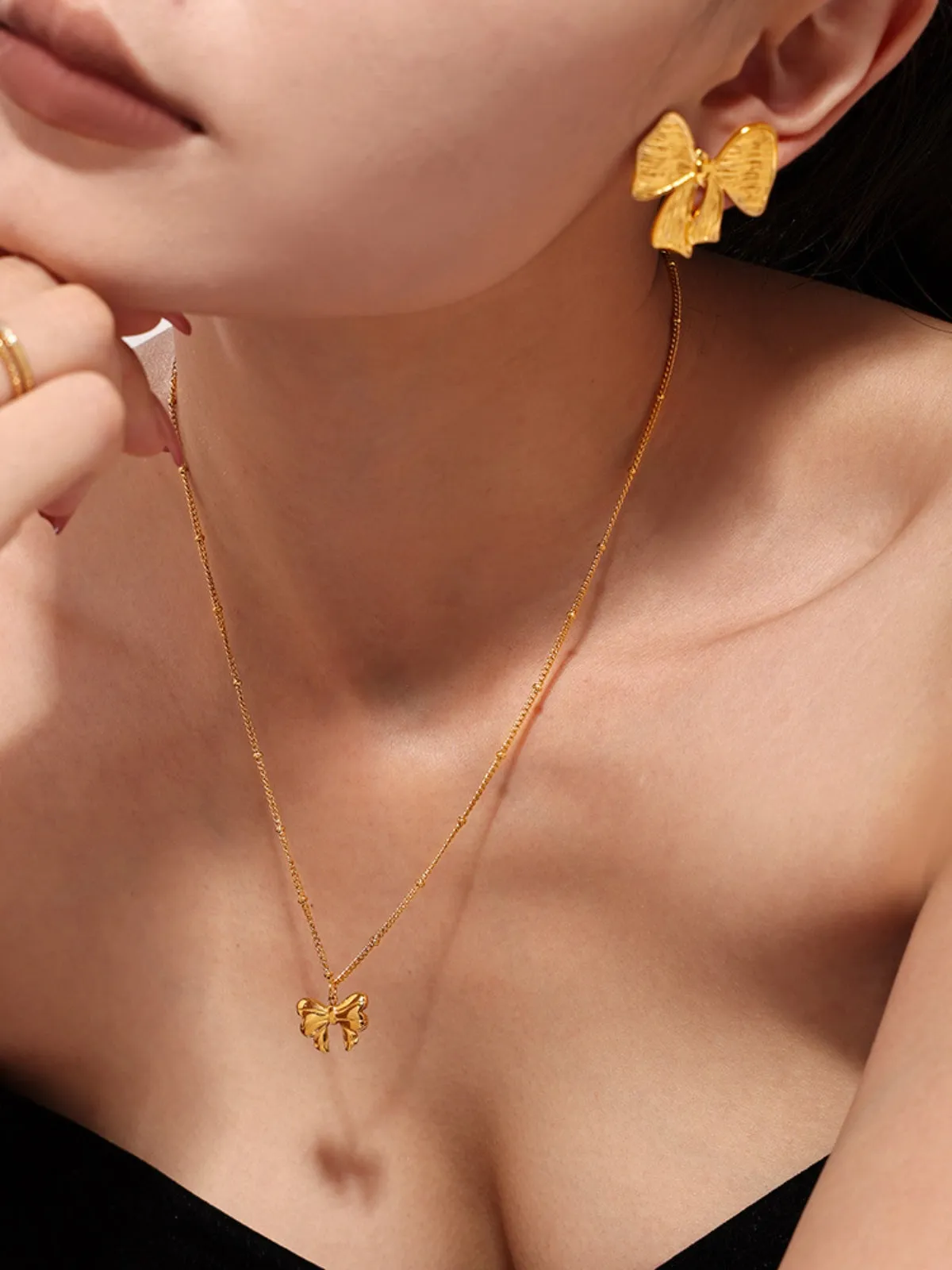 18K Gold-Plated Stainless Steel Bow Earrings and Necklace Set sold by Charming Charlie