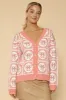 Bow tiled knit cardigan sold by Charming Charlie