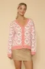 Bow tiled knit cardigan sold by Charming Charlie