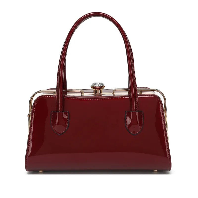 Patent Leather Frame Satchel sold by Charming Charlie