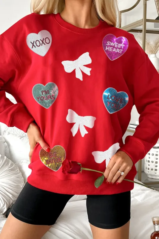 Valentine’s Day Sequin Bow Heart Round Neck Sweatshirt sold by Charming Charlie