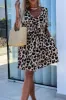 Cutout Back Leopard V-Neck Short Sleeve Mini Dress sold by Charming Charlie