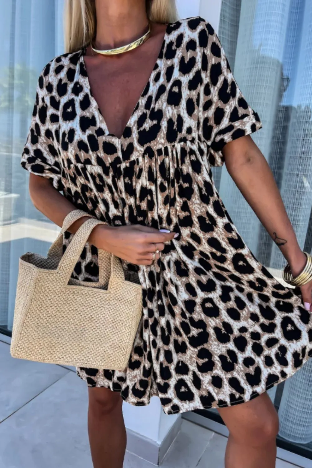 Cutout Back Leopard V-Neck Short Sleeve Mini Dress sold by Charming Charlie