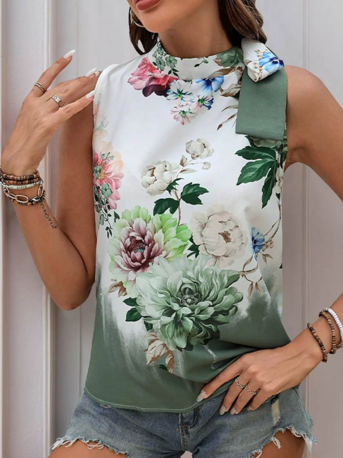 Tied Flower Printed Mock Neck Top sold by Charming Charlie