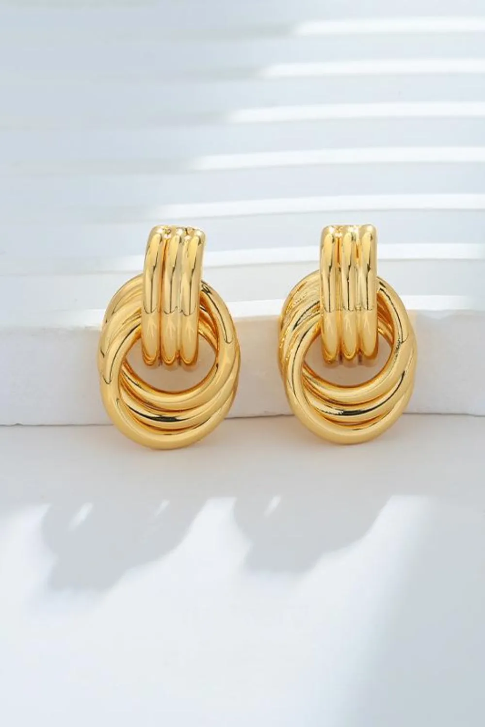 Gold-Plated Knotted Stud Earrings sold by Charming Charlie product image thumbnail 2