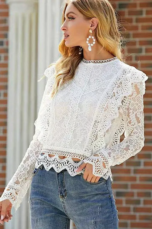 All over lace long sleeve blouse sold by Charming Charlie