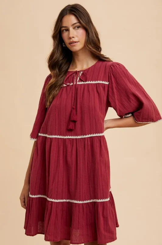 Annie Wear Tassel Contrast Trim Tie Neck Half Sleeve Tiered Dress sold by Charming Charlie