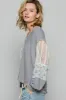 POL Floral Crochet Patch V-Neck Top sold by Charming Charlie