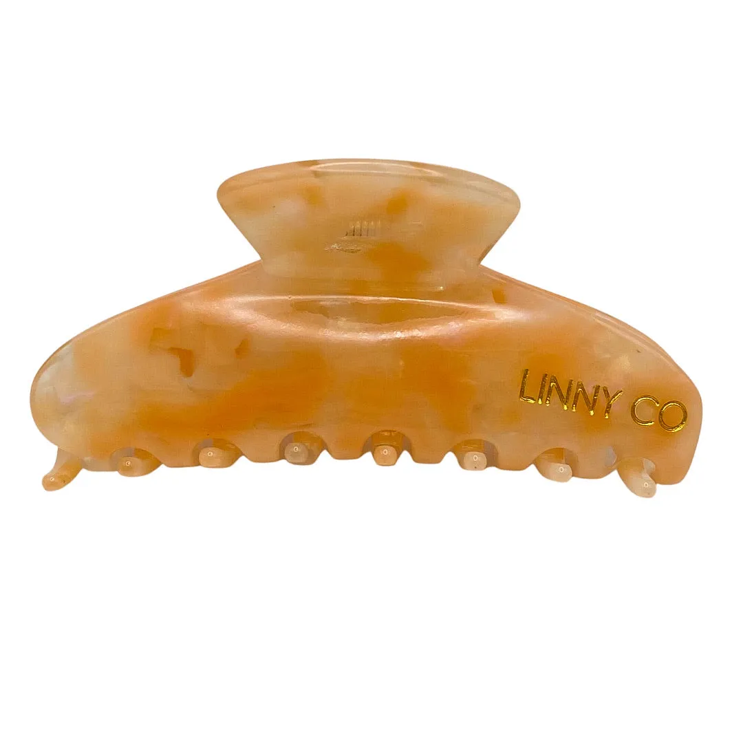 Mimi - Pearlized Peach sold by Charming Charlie