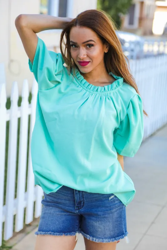 Follow Me Mint Frill Mock Neck Woven Top sold by Charming Charlie