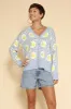 Tiled lemon knit cardigan sold by Charming Charlie