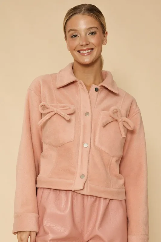 Fleece bow jacket sold by Charming Charlie