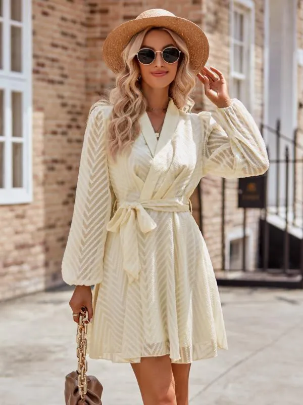 Long sleeve wrap front dress sold by Charming Charlie