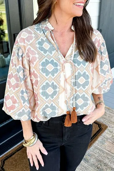 Tassel Tie Neck Balloon Sleeve Blouse sold by Charming Charlie
