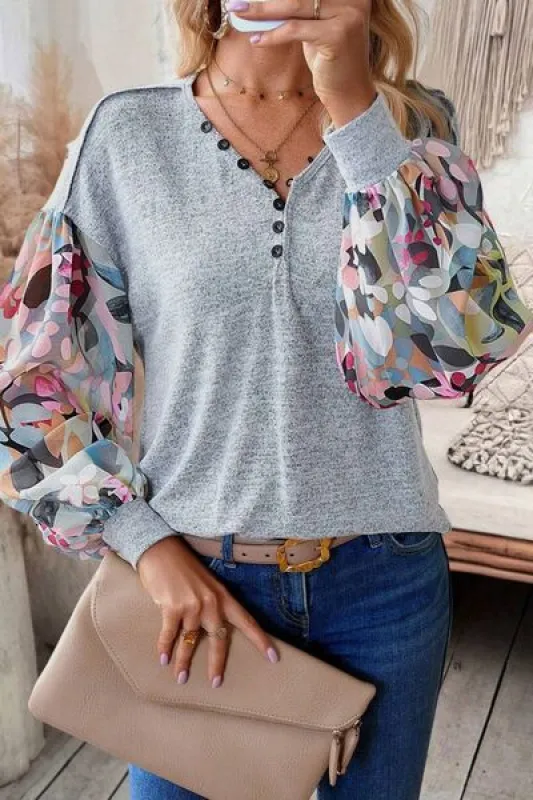 Printed Lantern Sleeve Buttoned V Neck Top sold by Charming Charlie