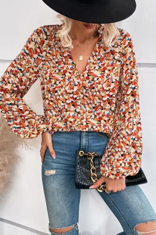 Printed Notched Long Sleeve Blouse sold by Charming Charlie