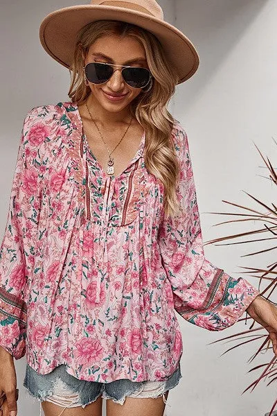 Floral blouse sold by Charming Charlie