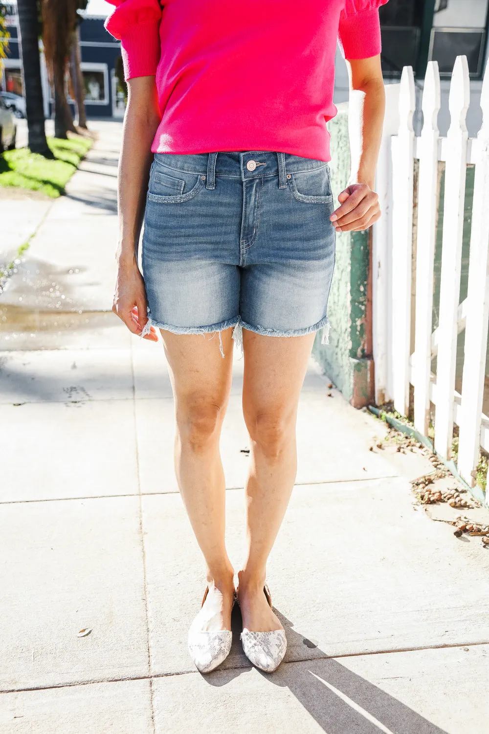 Dark Denim Mid rise raw frayed hem denim shorts sold by Charming Charlie product image thumbnail 4