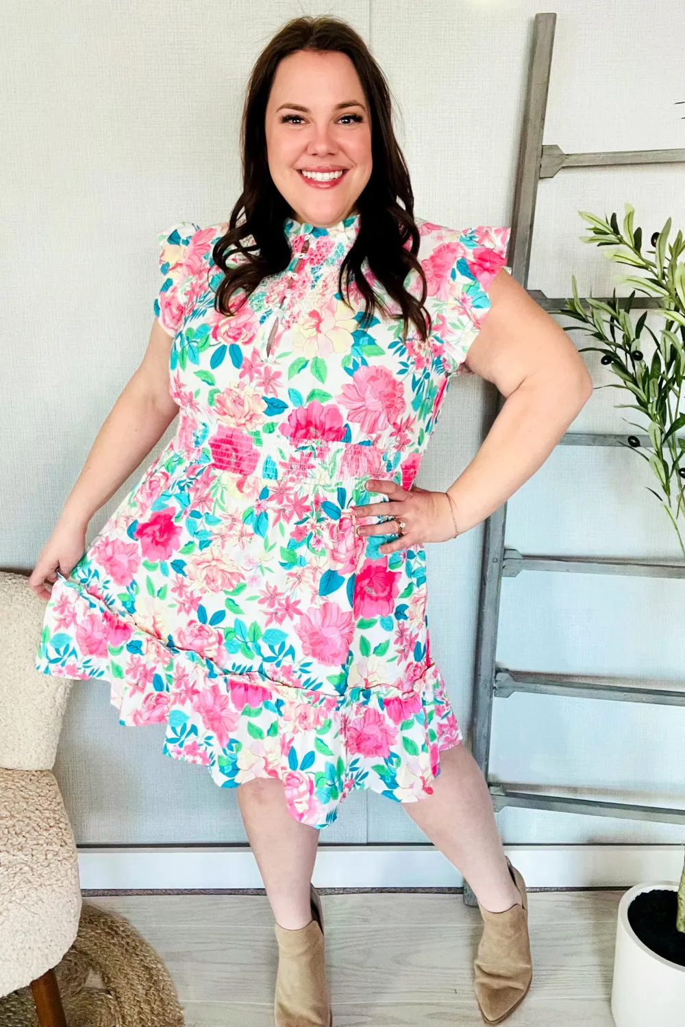 Under Your Spell Floral Smocked Flutter Sleeve Ruffle Mini Dress sold by Charming Charlie