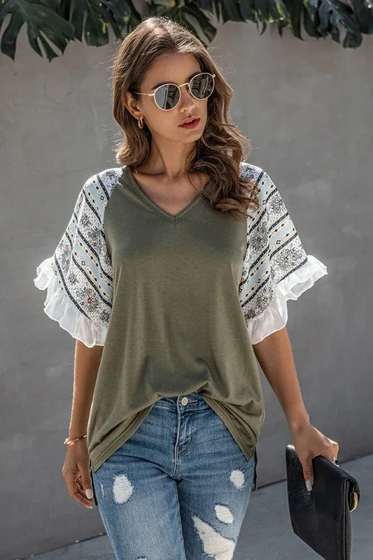 Printed ruffled sleeve top sold by Charming Charlie