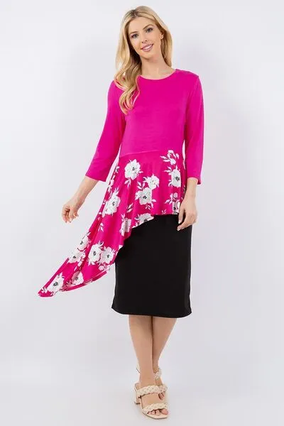 Celeste Full Size Floral Asymmetrical Hemline Round Neck Top Plus Size sold by Charming Charlie