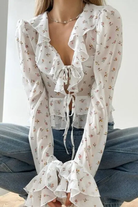 Ruffled Floral Tied Long Sleeve Blouse sold by Charming Charlie
