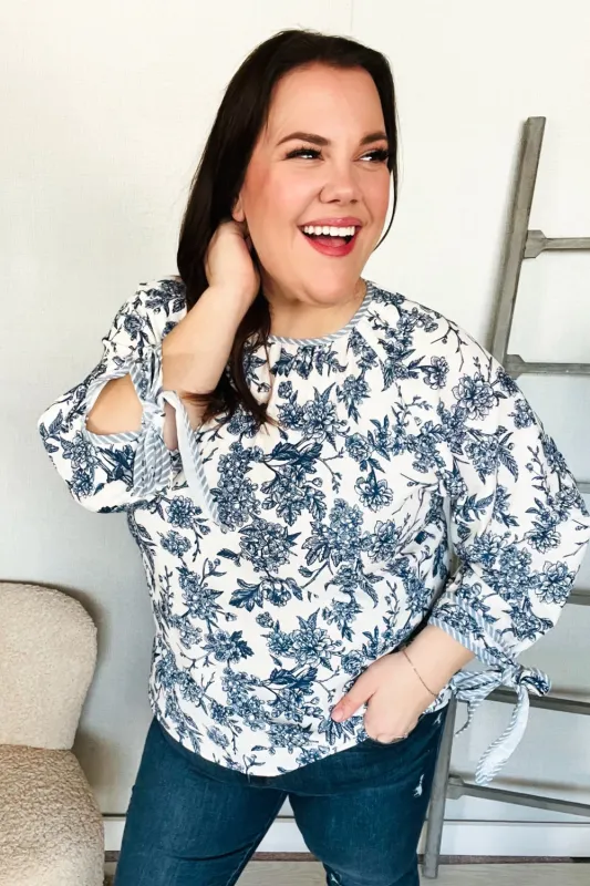 Vintage Chic Navy & Ivory Three-Quarter Bow Sleeve Contrast Stripe Blouse sold by Charming Charlie