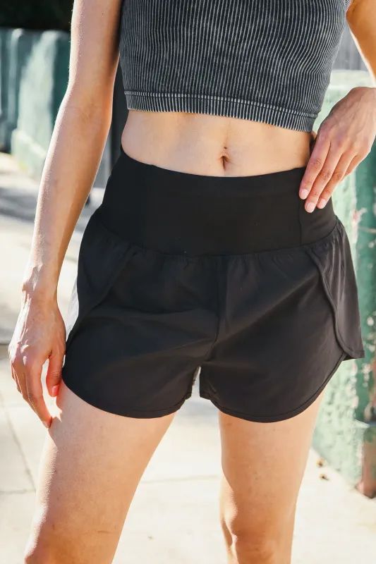 Black High Waist Zipper Back Pocket Running Shorts sold by Charming Charlie