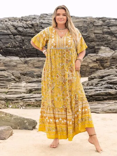 Plus Size Floral Tie Neck Flutter Sleeve Maxi Dress sold by Charming Charlie