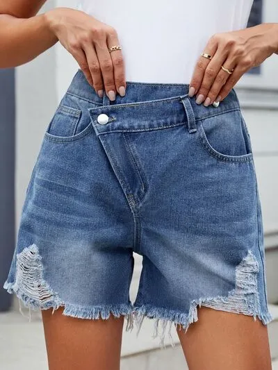 Distressed Raw Hem Asymmetrical Waist Denim Shorts sold by Charming Charlie