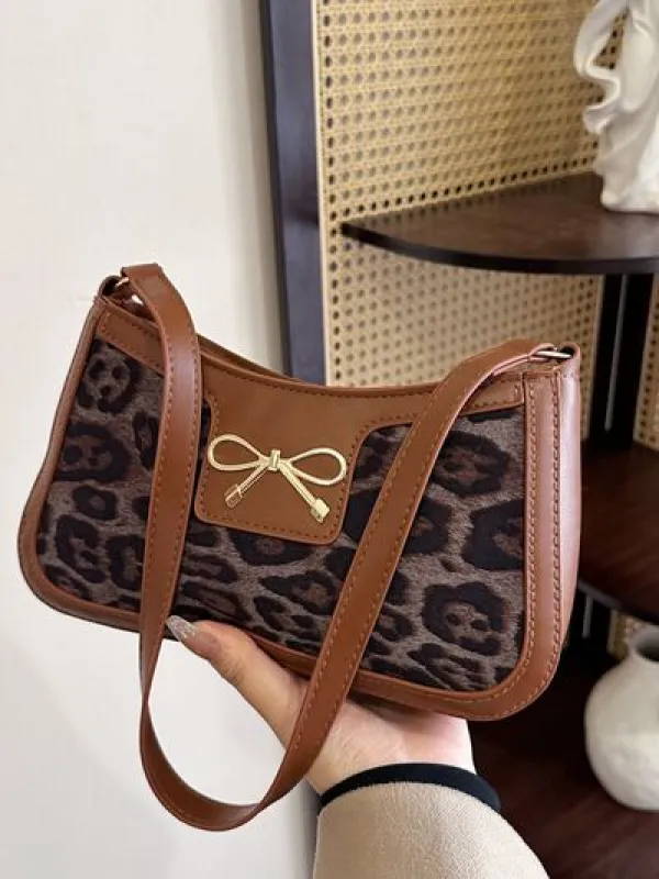 Bow Leopard PU Leather Handbag sold by Charming Charlie