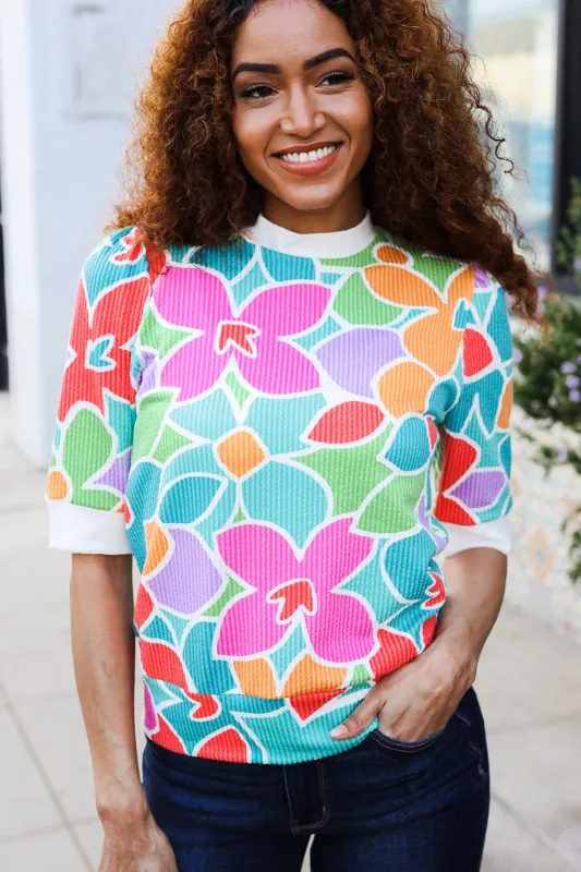 Spring Vibes Multicolor floral Rib Back Bow Tie Detail Top sold by Charming Charlie