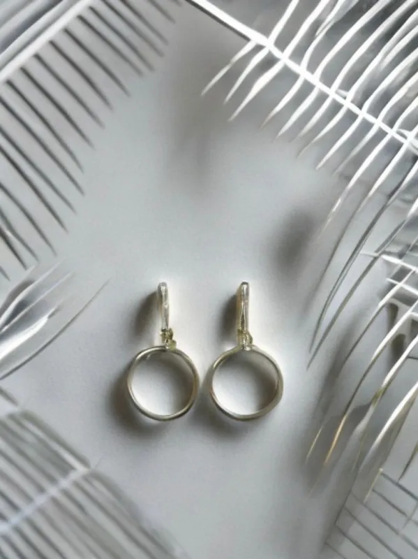 The Sak- Silver Post Hoop Earrings sold by Charming Charlie