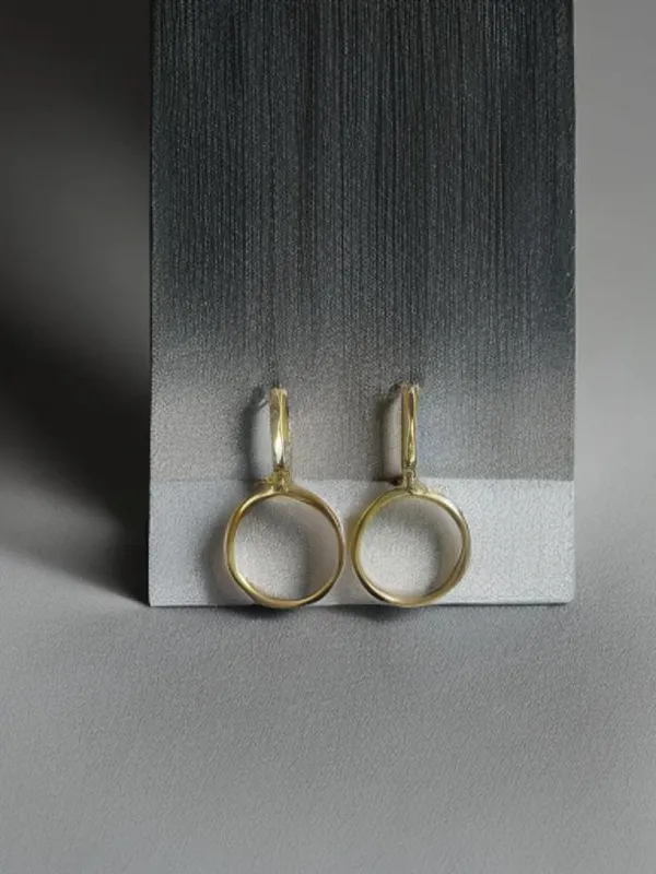 The SAK- Gold Drop Hoop Earrings made by Charming Charlie