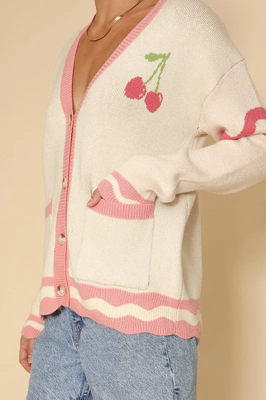Heart cherry varsity knit cardigan sold by Charming Charlie