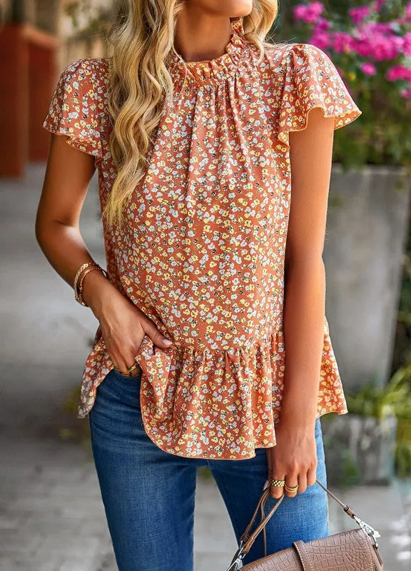 Floral ruffle blouse sold by Charming Charlie