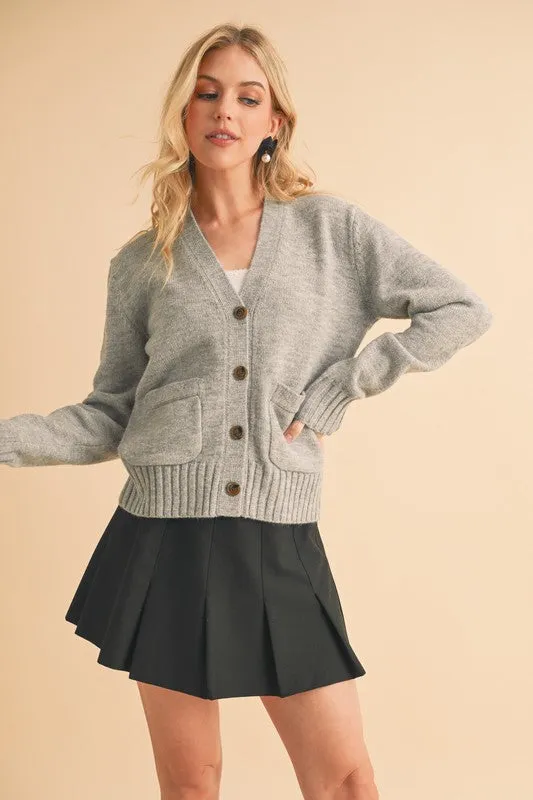 Aemi + Co Ribbed Hem Button Down V-Neck Cardigan sold by Charming Charlie