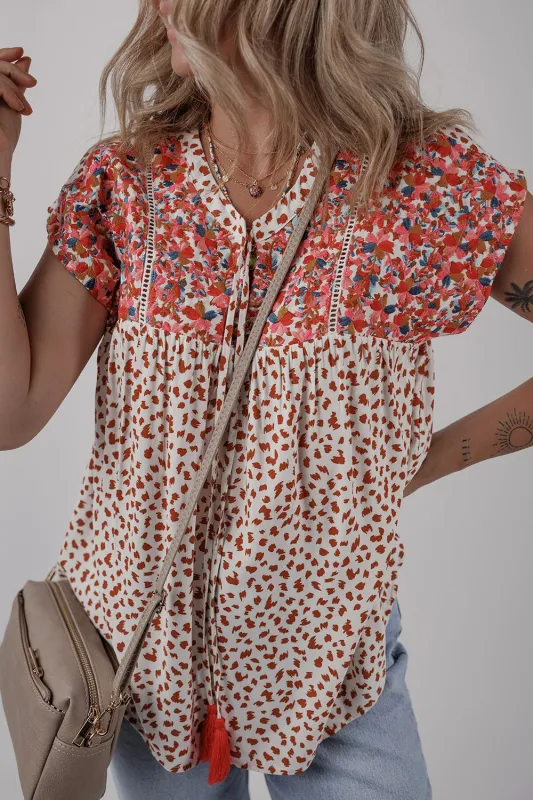 Printed Floral Embroidery Tie Neck Blouse sold by Charming Charlie