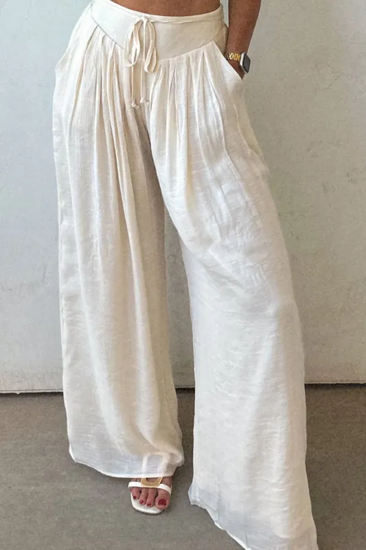 Tie Waist Pleated Wide Leg Pants sold by Charming Charlie