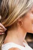 18K STAINLESS STEEL TWISTED HOOP EARRINGS sold by Charming Charlie