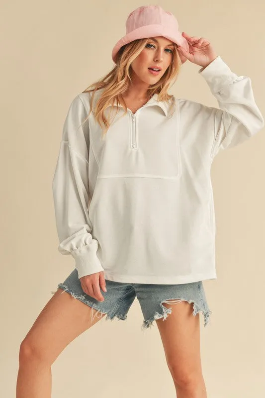 Aemi+Co Exposed Seam Half Zip Drop Shoulder Sweatshirt sold by Charming Charlie