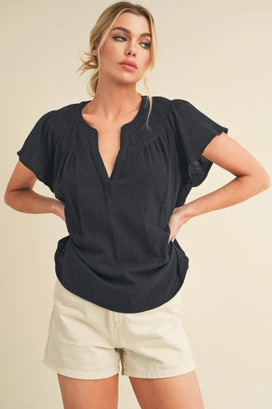 Aemi + Co Embroidered Trim Side Slit Notched Short Sleeve Blouse sold by Charming Charlie