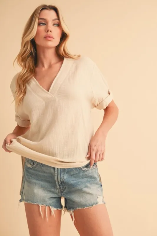Aemi + Co Side Slit V-Neck Short Sleeve Blouse sold by Charming Charlie
