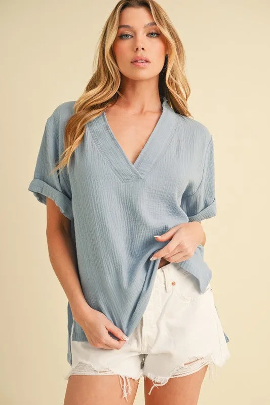 Aemi + Co Side Slit V-Neck Short Sleeve Blouse sold by Charming Charlie
