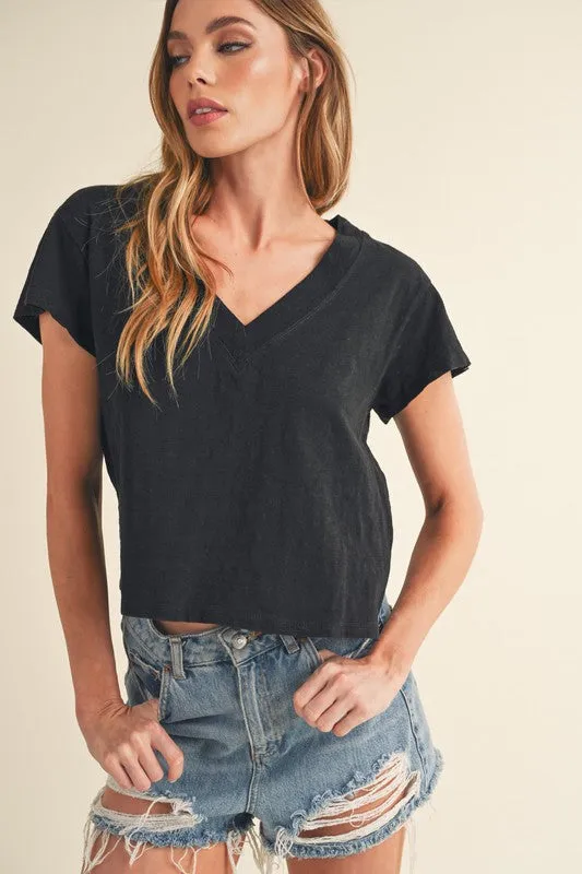 Aemi + Co Side Slit V-Neck Short Sleeve Cropped T-Shirt sold by Charming Charlie